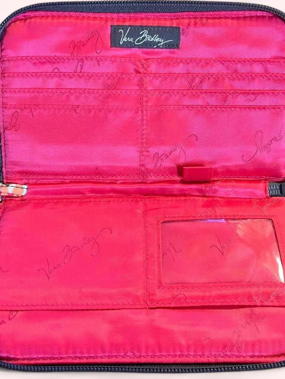 Vera Bradley floral zip around quilted wallet with wrist strap.
